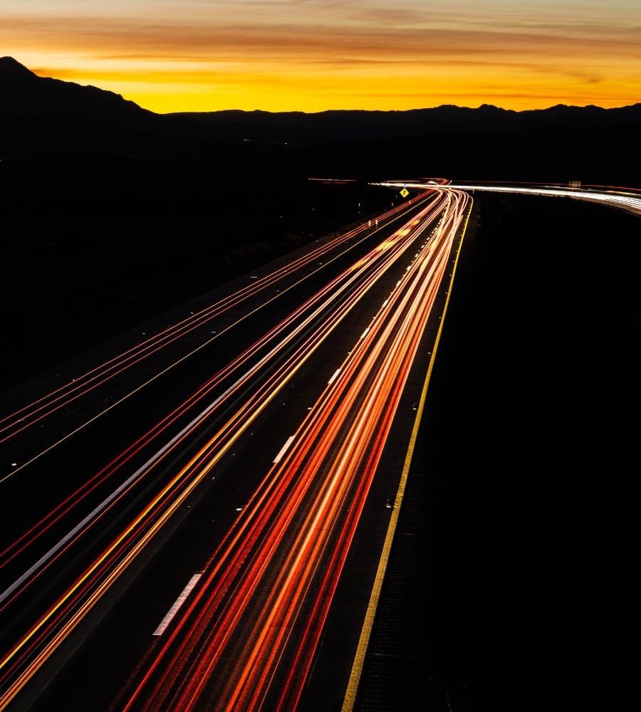 cars on highway sunset