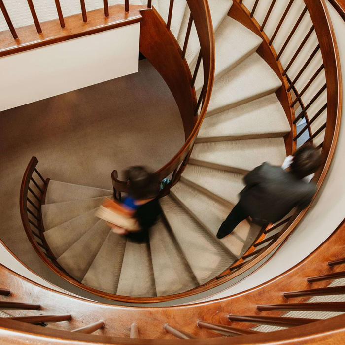 Stairwell with two people walking up and down