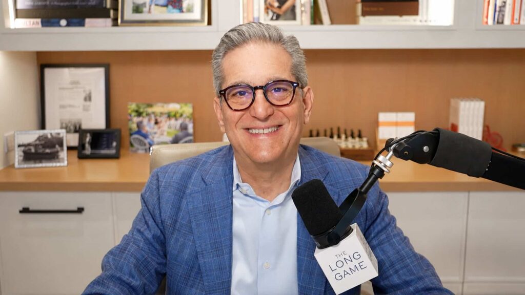 Eric Becker Headshot with podcast microphone