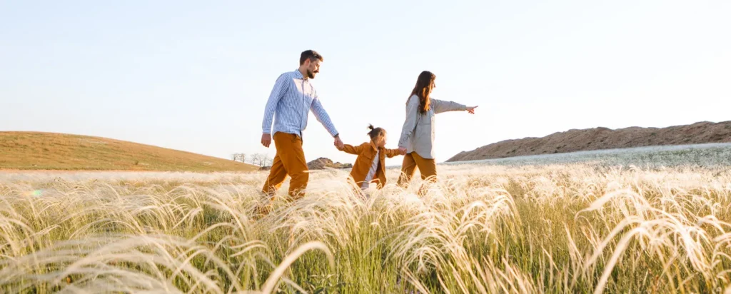 family walking in a field
