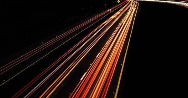 cars on highway sunset